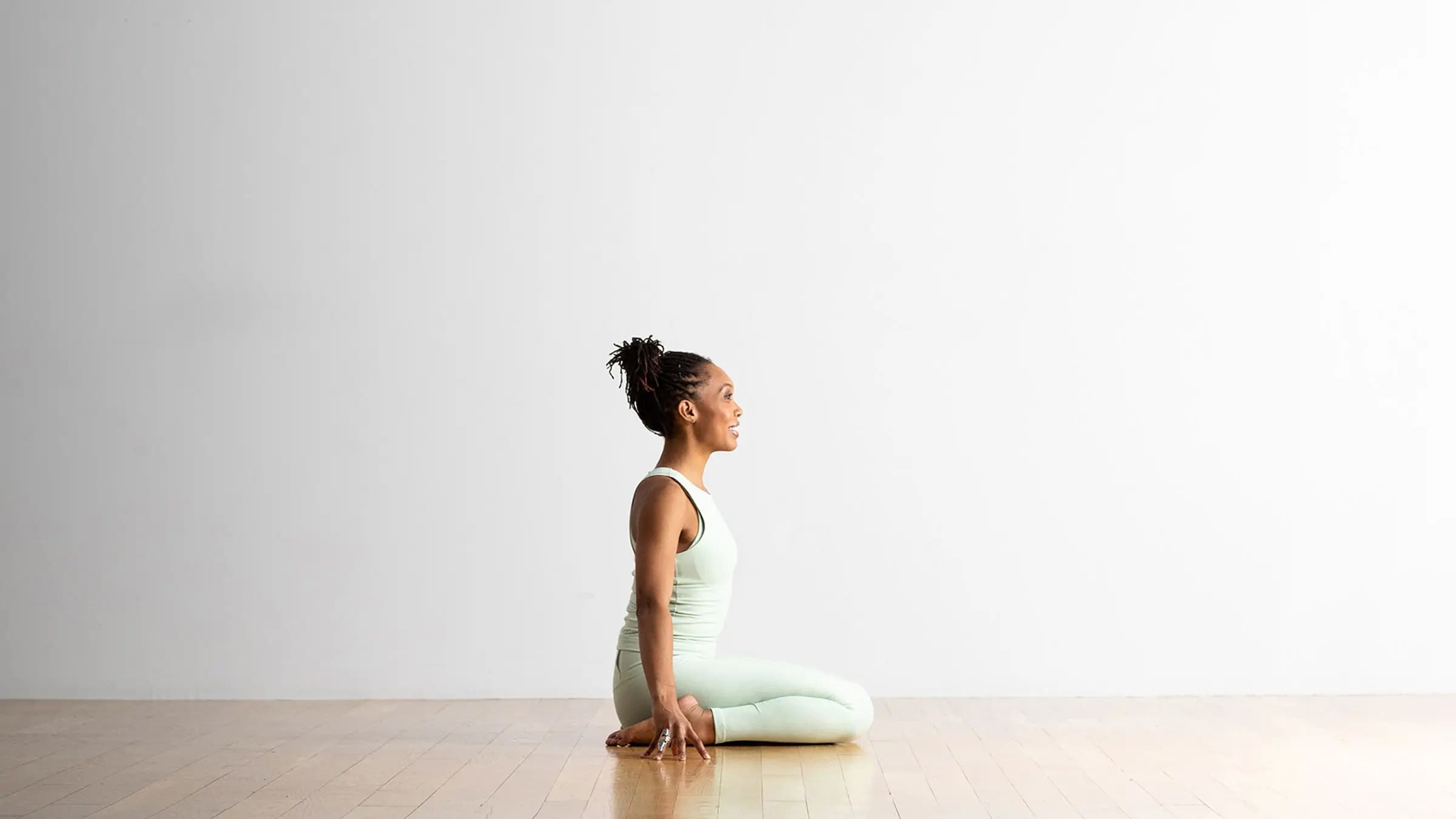 A woman in Hero Pose