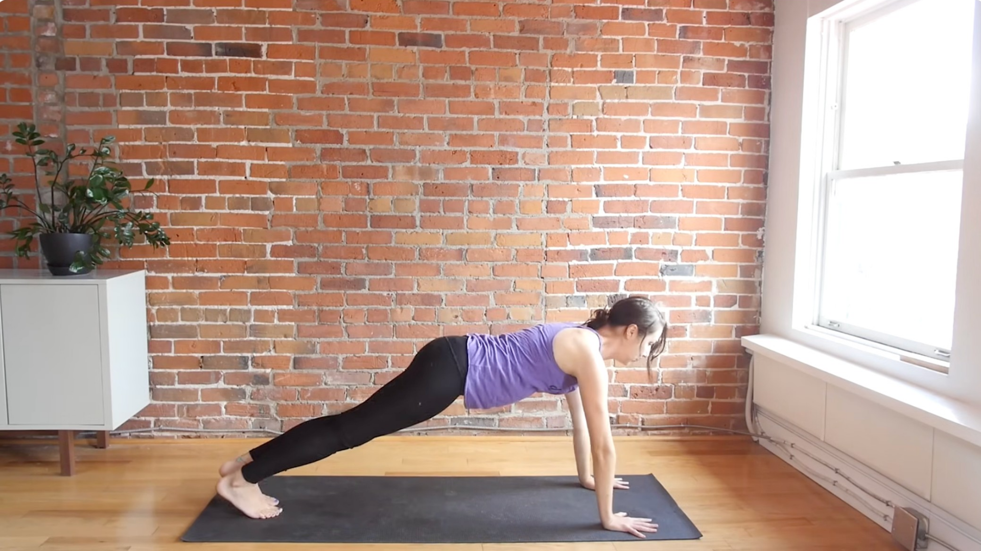 Woman in a high push-up or plank