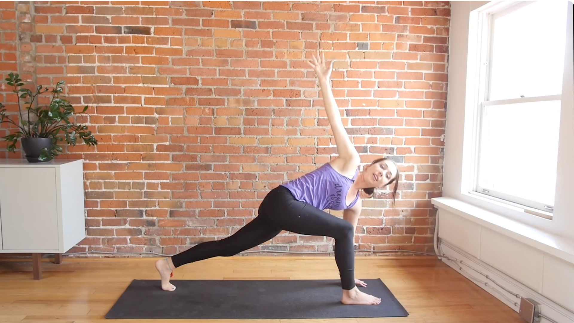 Yoga with Kassandra in a Revolved Twist