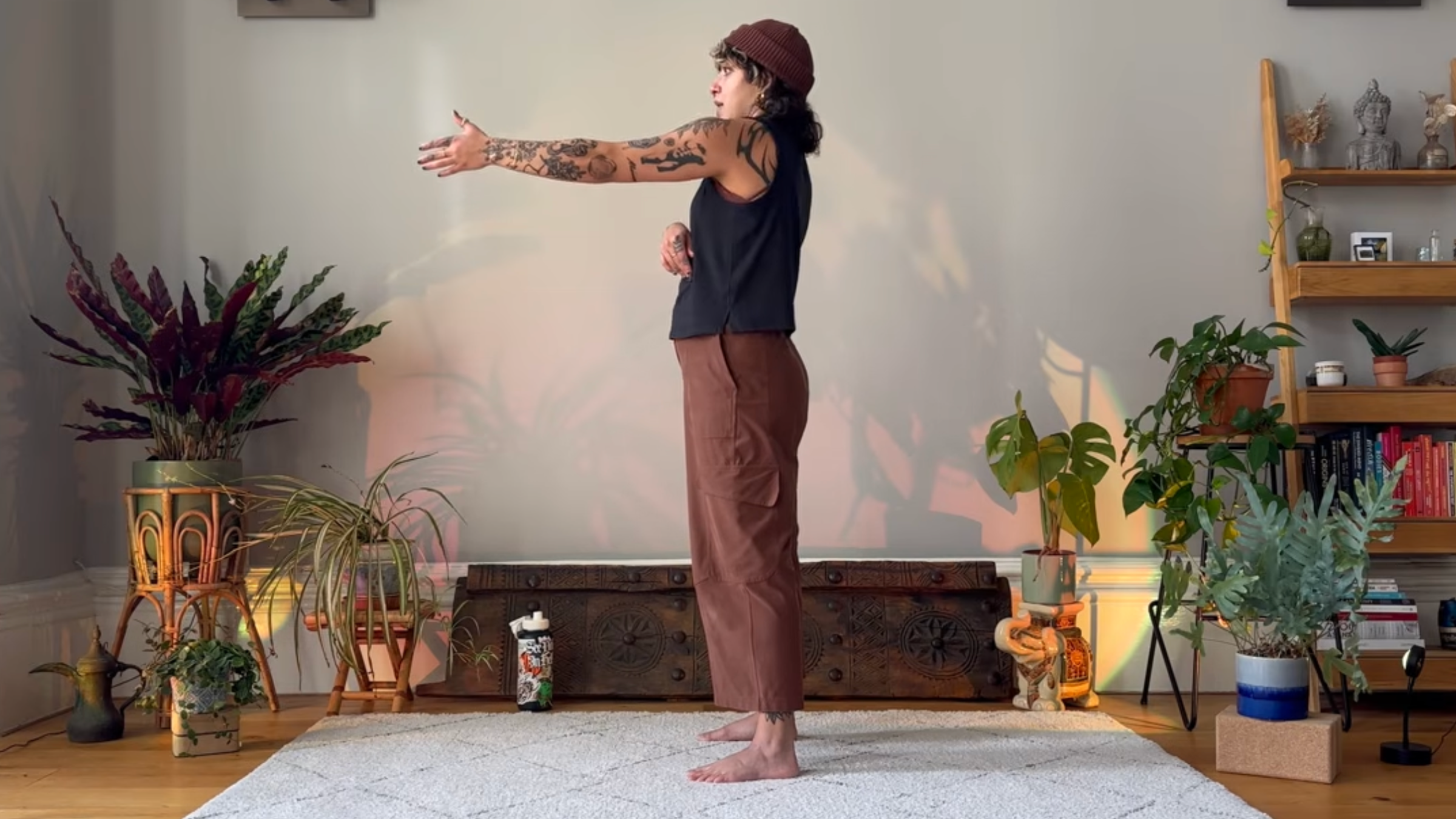 Yoga teacher Olive Walton practicing shoulder rotations.