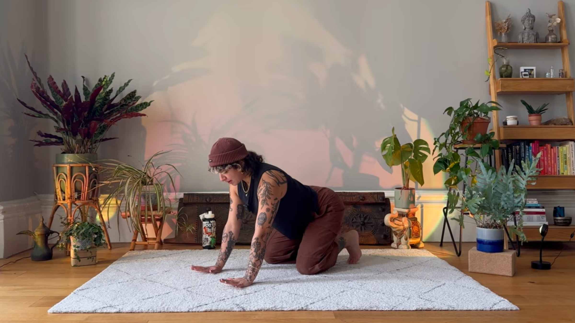 Yoga instructor practicing wrist stretches.