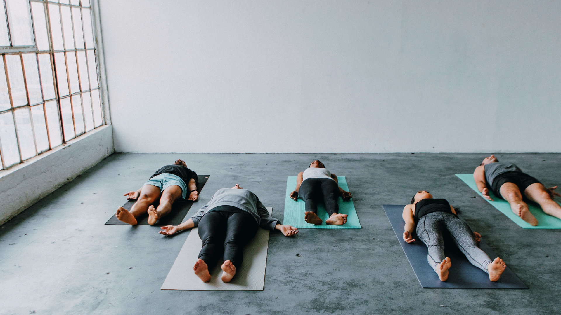 Sound Bowls, Sutras, and Silence: What Exactly Is Your Yoga Teacher Doing While You’re in Savasana?
