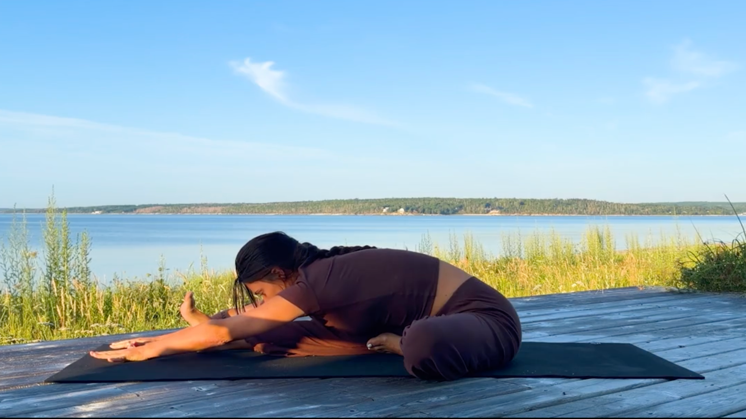 Teacher Emily Baltzer in Head-to-Knee, one of her seated yoga poses
