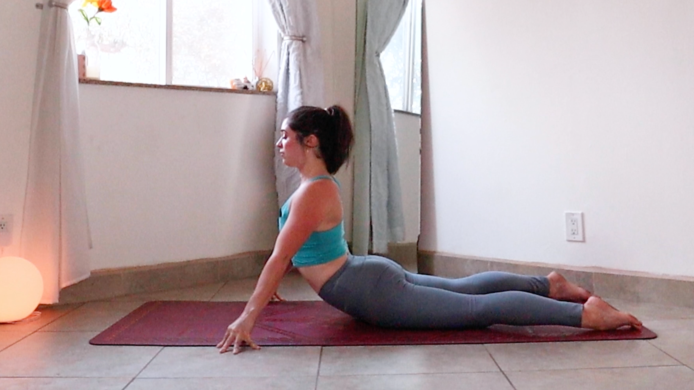 Yoga teacher Daria LeGrand in High Cobra, a pose to relieve muscle tightness