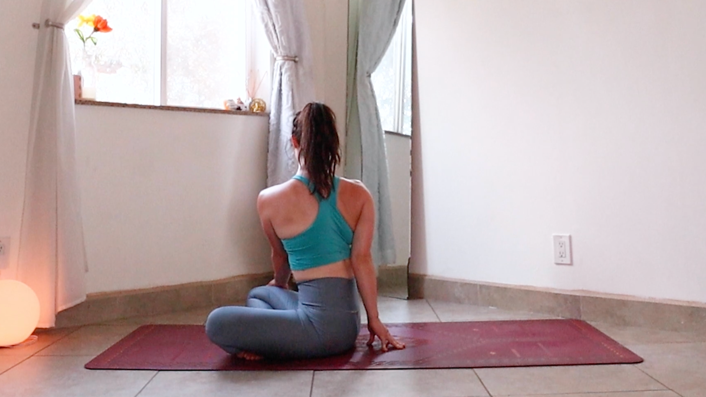 Yoga teacher Daria LeGrand in Seated Side Plank