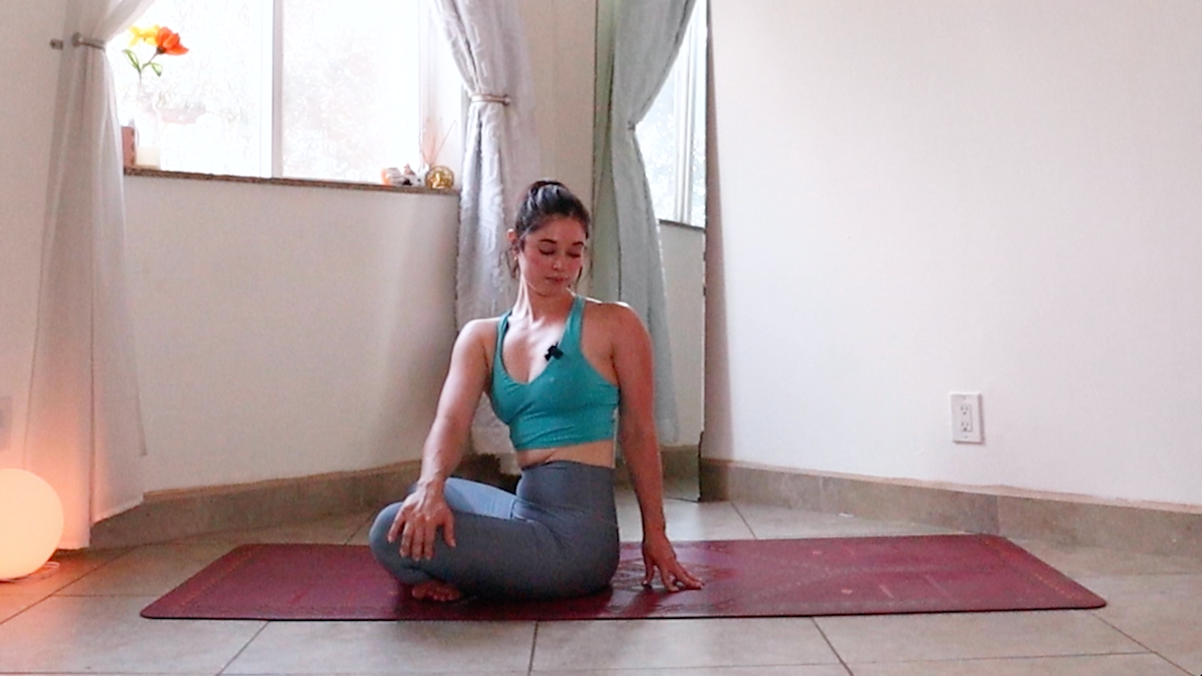 Yoga teacher Daria LeGrand in Seated Side Plank