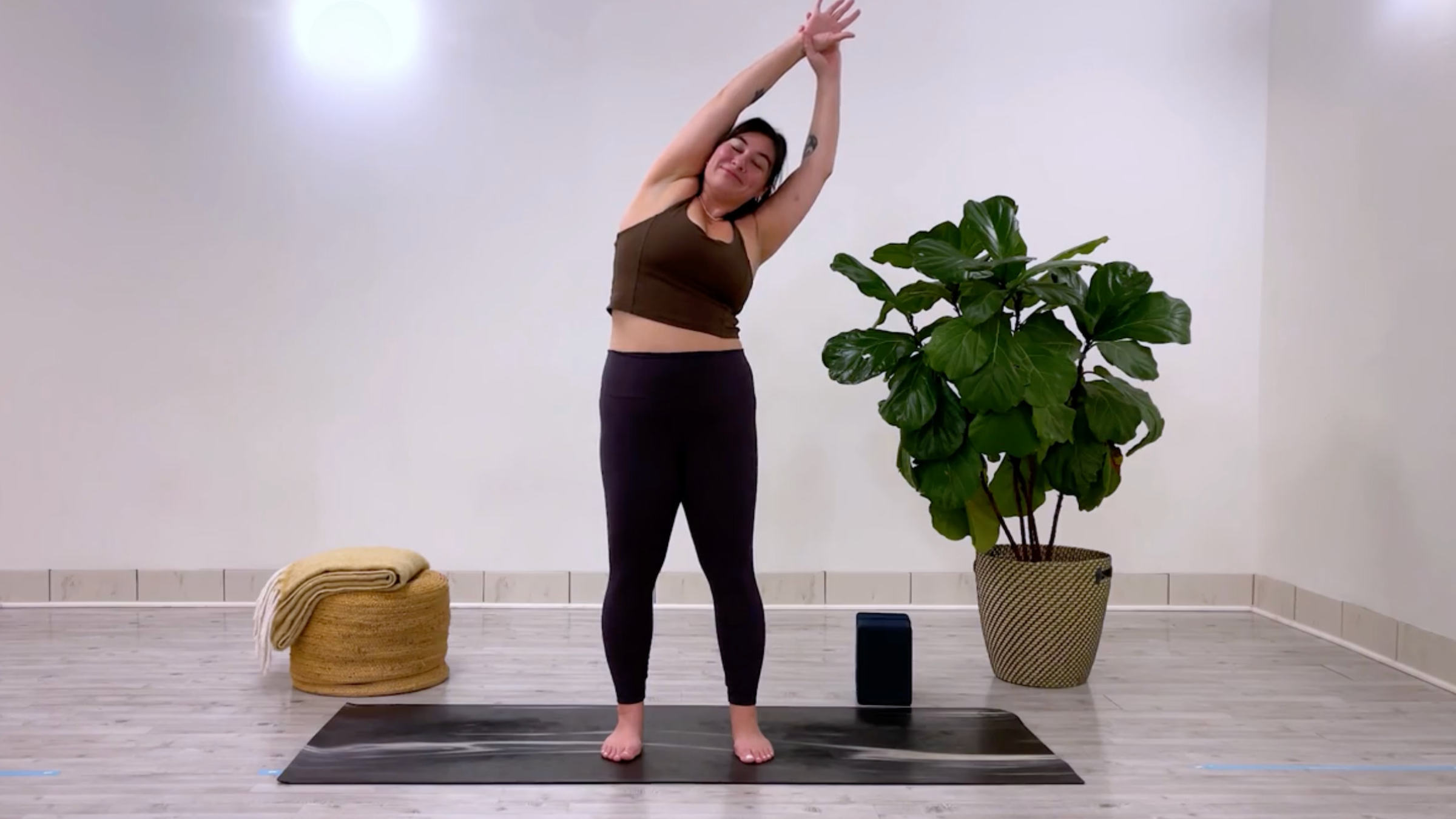 Yoga teacher Taylor Lorenz in Standing Side Bend