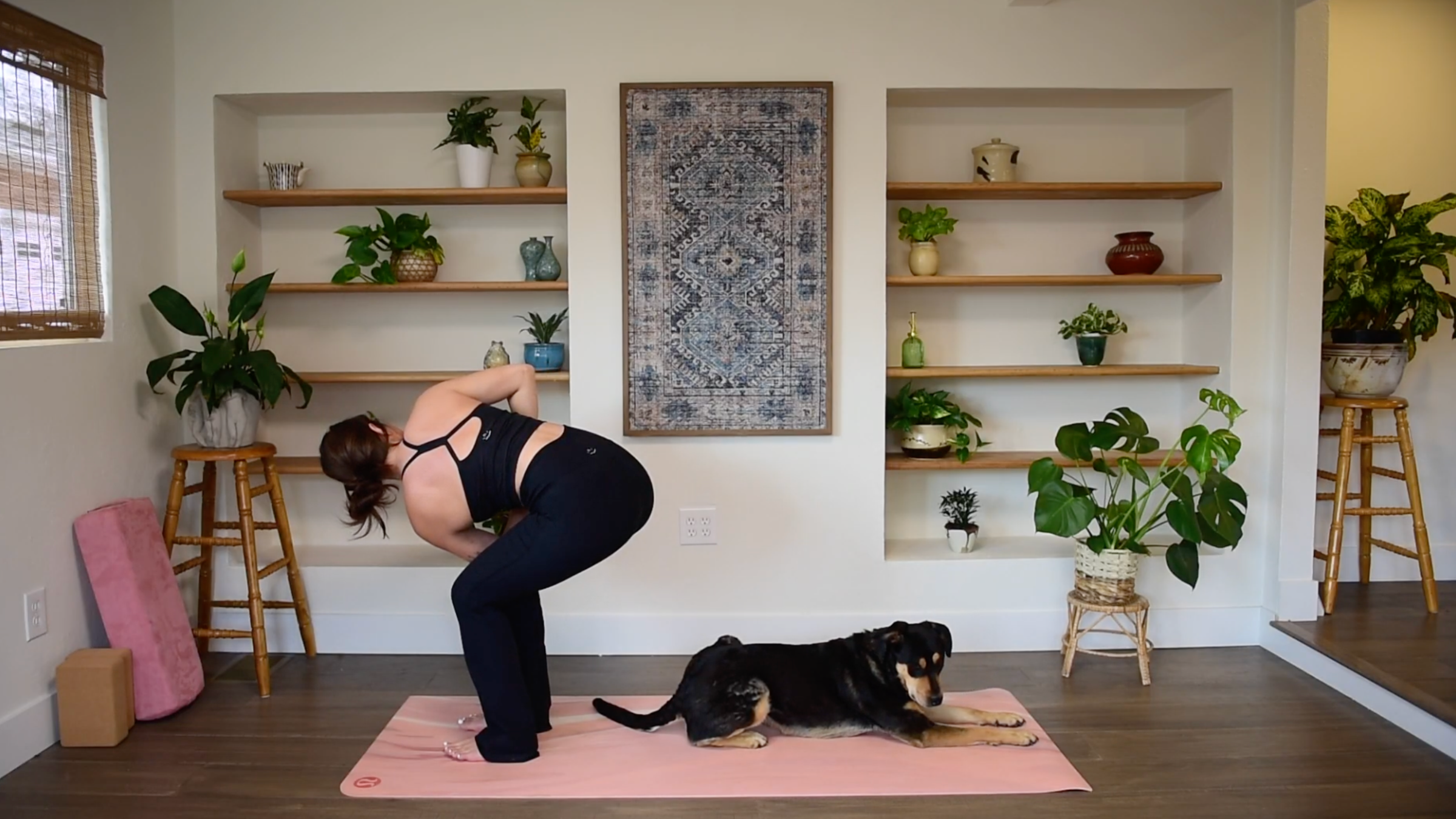 Caitlin K'eli in Revolved Chair Pose.