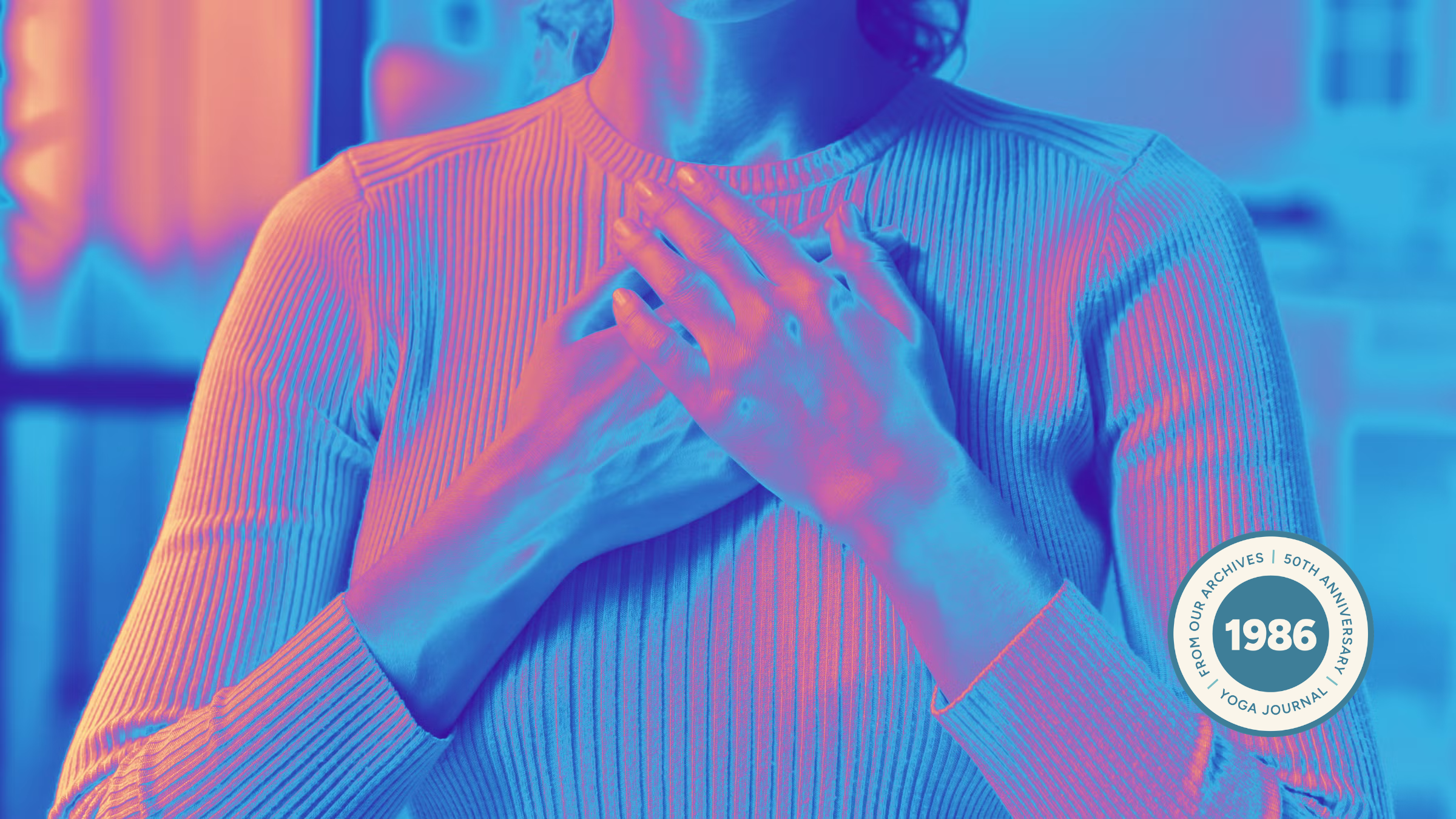 A person with hands over their heart, symbolizing an empath