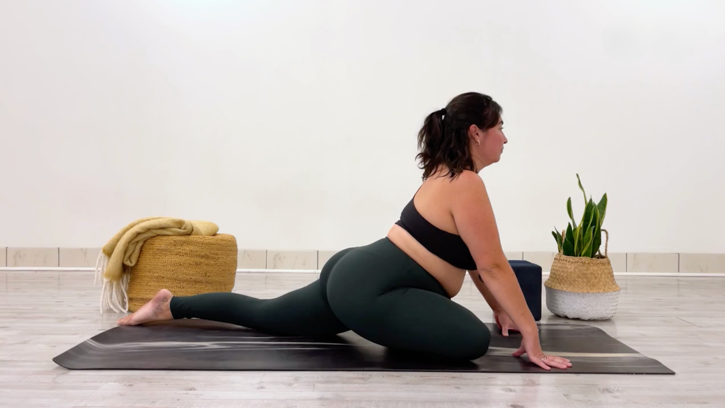 Yoga teacher Taylor Lorenz in Swan Pose, or Pigeon Pose, Eka Pada Rajakapotasana in Sanskrit