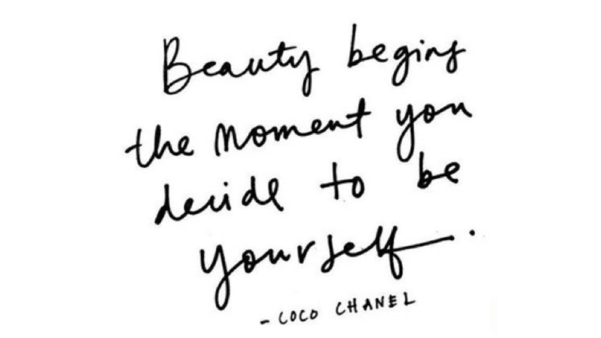 Black handwritten quote by Coco Chanel about being yourself against a white backdrop