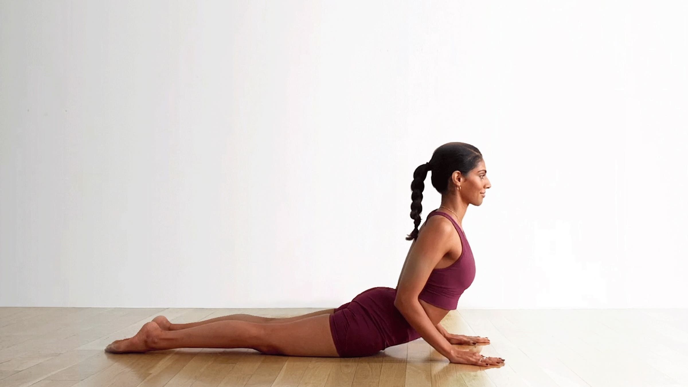 A woman in Cobra Pose, Bhujangasana in Sanskrit, one of yoga's best neck stretches