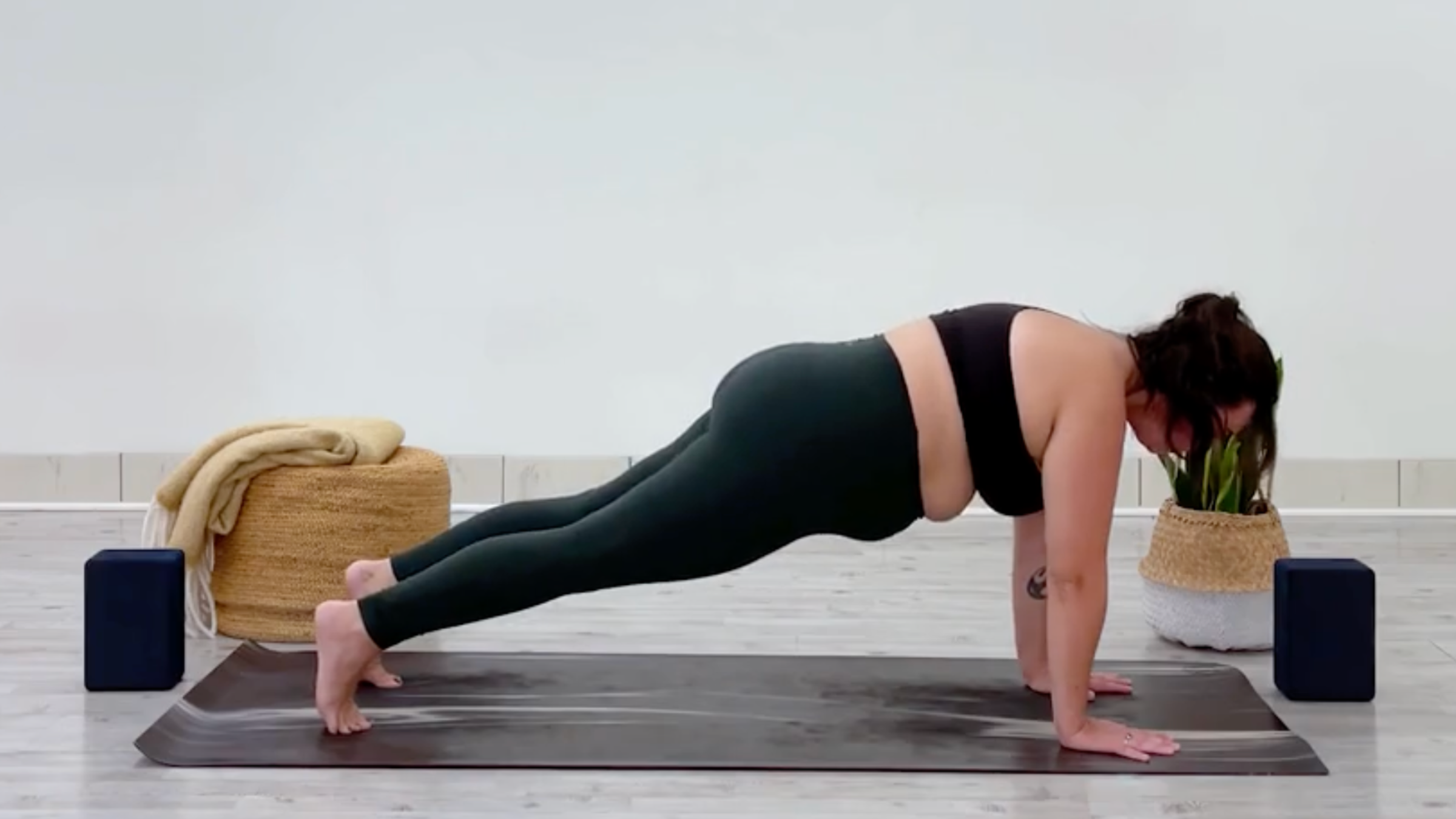 Yoga teacher Taylor Lorenz in Plank Pose, part of her yoga for balance practice