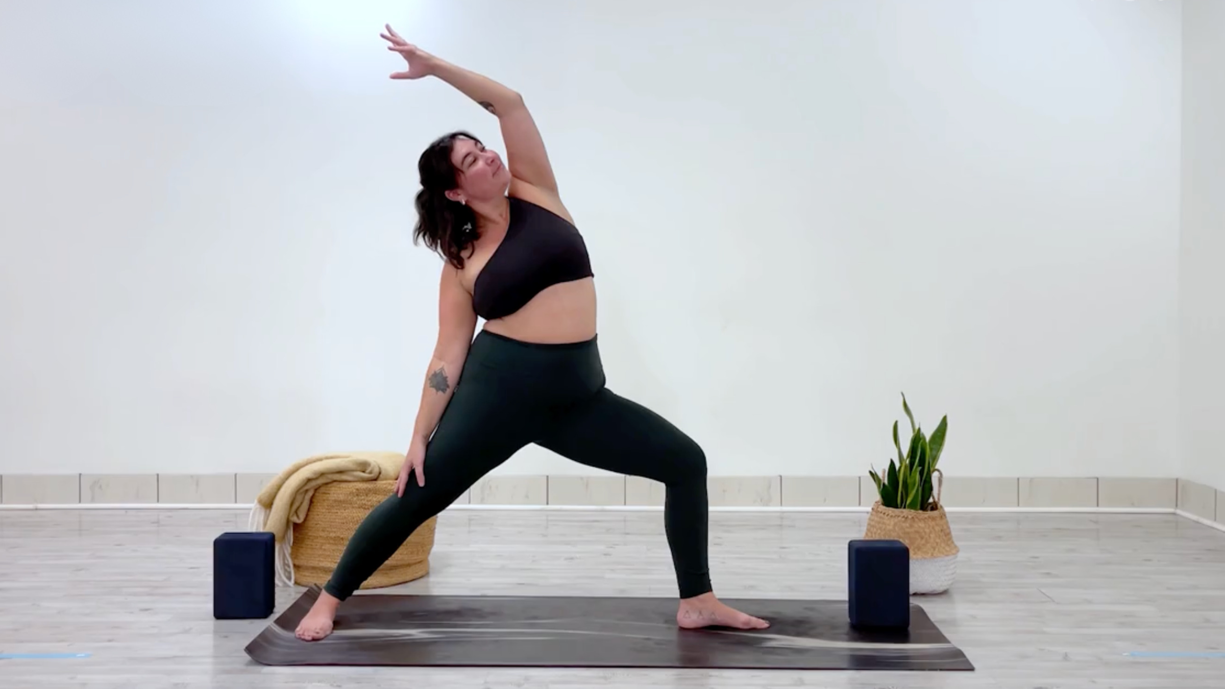 Teacher Taylor Lorenz in Reverse Warrior, Viparita Virabhadrasana in Sanskrit