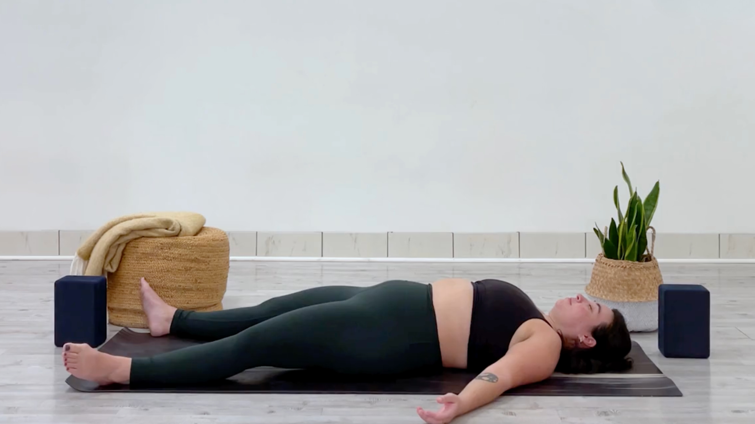 Teacher Taylor Lorenz in Savasana
