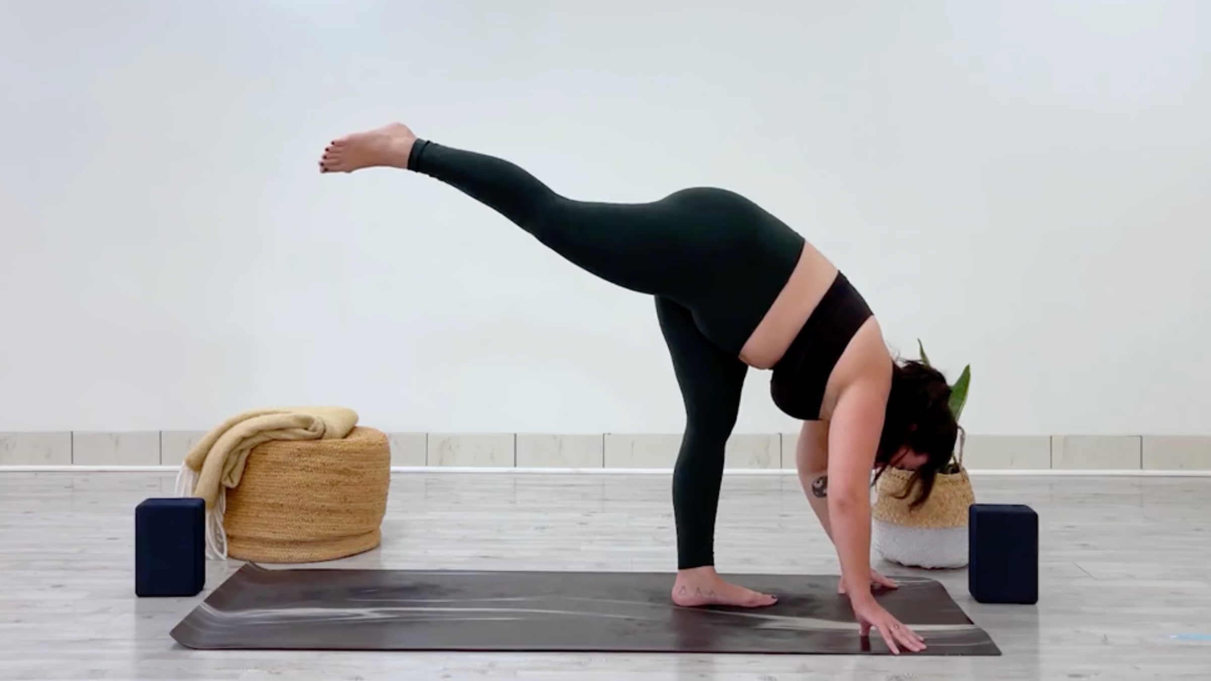 Teacher Taylor Lorenz in Standing Splits, Urdhva Prasarita Eka Padasana in Sanskrit